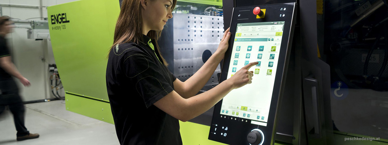 A user is working with the engel hmi.